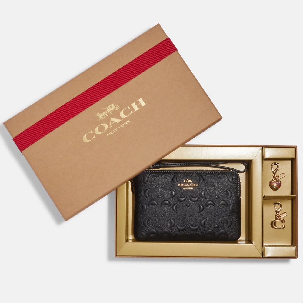 Coach Gift Boxed Corner Zip Leather Wristlet with 2 removable Charms.